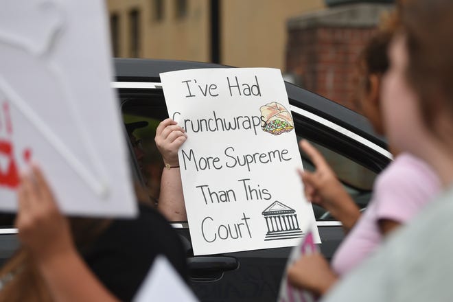 Demonstrator march during a June 26 rally in downtown Knoxville in support of abortion rights and in response to the overturning of Roe v. Wade.