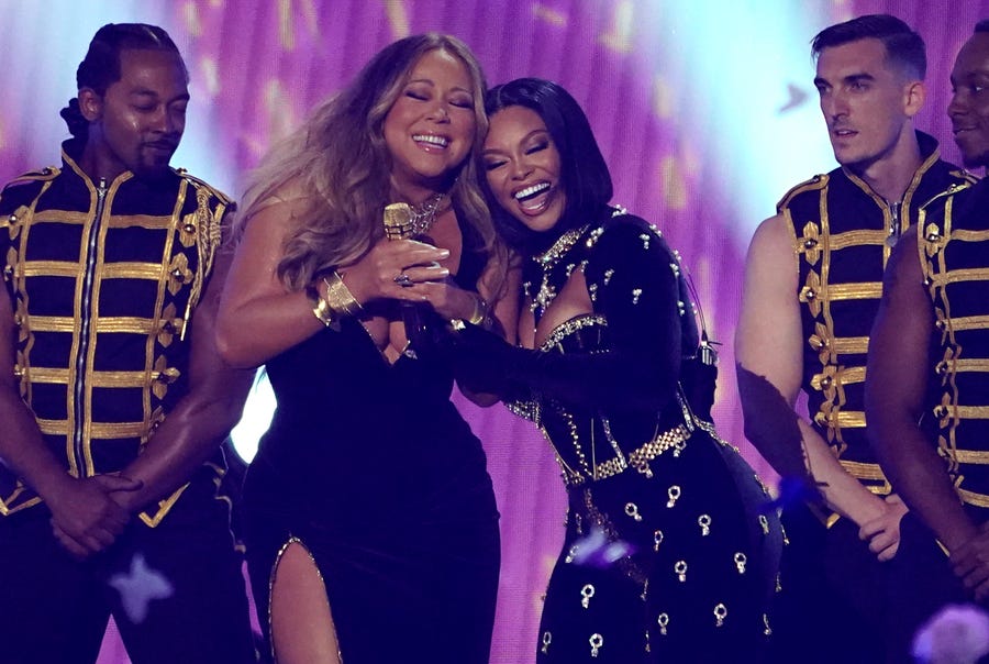 Mariah Carey, left, and Latto perform at the BET Awards on Sunday, June 26, 2022, at the Microsoft Theater in Los Angeles. (AP Photo/Chris Pizzello) ORG XMIT: CADA926