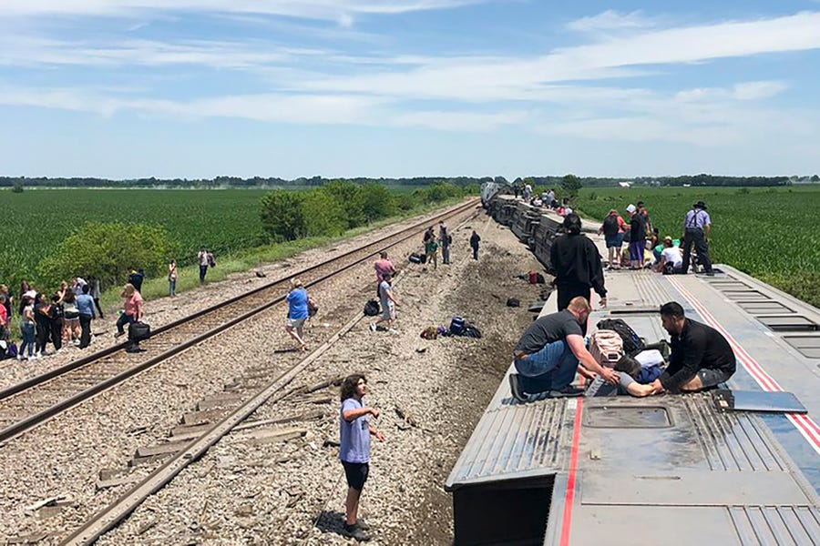 An Amtrak passenger train lies on its side after derailing near Mendon, Missouri. The Southwest Chief, traveling from Los Angeles to Chicago, was carrying about 243 passengers when it collided with a dump truck near Mendon, Amtrak spokeswoman Kimberly Woods said.