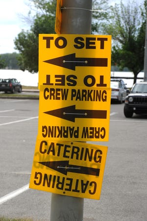 Signage directing crew and actors is shown on Monday in a parking lot near the the Presque Isle channel (background) and Lampe Marina on Erie's east bayfront.
