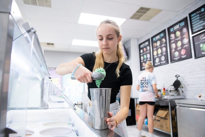 Audrey Burns, 15, scoops mint chocolate chip ice cream into a malt glass while making a Grasshopper Freak Shake at Ripleigh's Eat it or Not Creamery on Thursday, June 23, 2022, in McSherrystown.