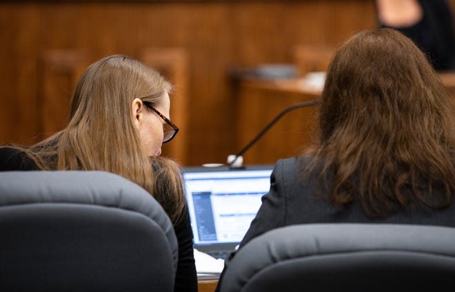 Rebecca Ruud (left) next to one of her attorneys during her trial in which she is charged with first-degree and second-degree murder, abuse or neglect of a child, tampering with physical evidence, and abandonment of a corpse in the death of her daughter Savannah Leckie in 2017.