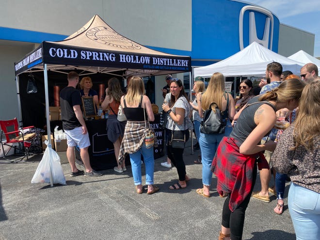 People lined up to get samples of the Cold Spring Hollow Distillery at the Greencastle Antrim Craft Beer, Wine, and Spirits Festival in April.  The distillery will be a participant in the Sip & Stroll in downtown Chambersburg on July 30.