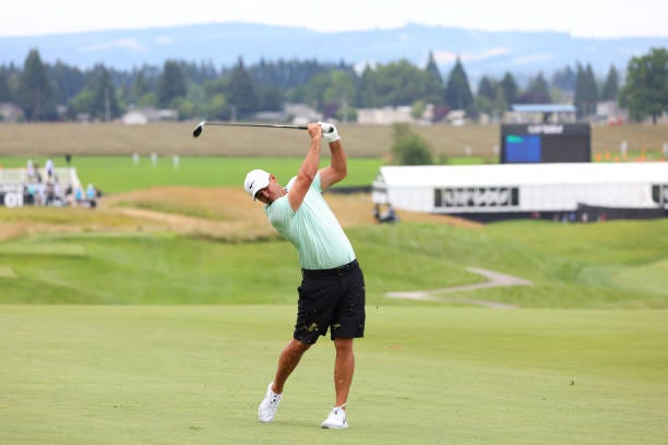 Brooks Koepka plays his second shot from the first hole during Wednesday's Pro-Am at the LIV Golf Invitational at Pumpkin Ridge Golf Club.