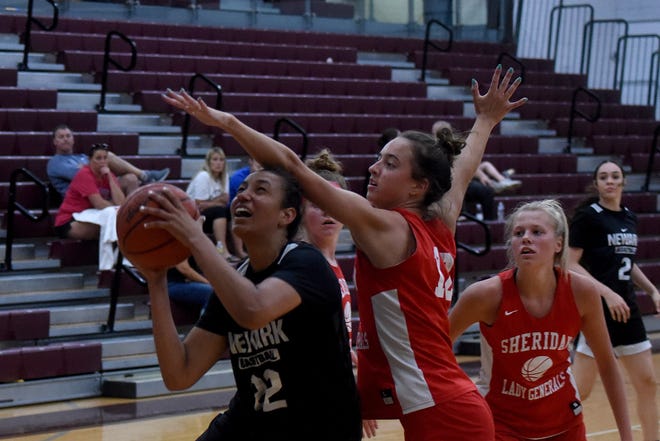 Newark's Jenna Shackleford shoots against defense from Sheridan's Halle Warner during summer league games on Tuesday, June 28, 2022 at Newark High School. Sheridan won the game 46-42.