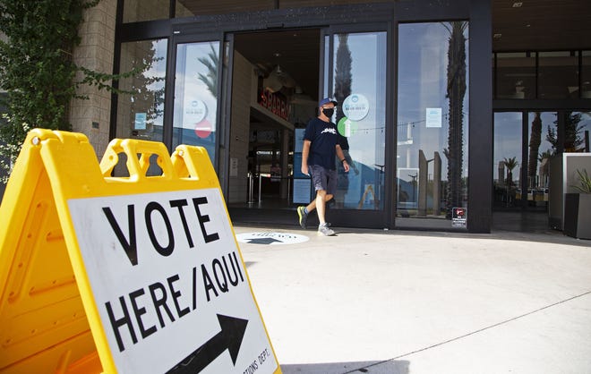 Voters walk out of a polling location at Arrowhead Towne Center in Glendale on Aug. 4, 2020.