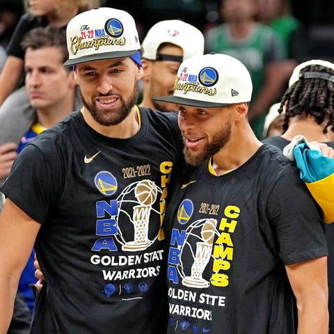 Stephen Curry and Klay Thompson celebrate their fo