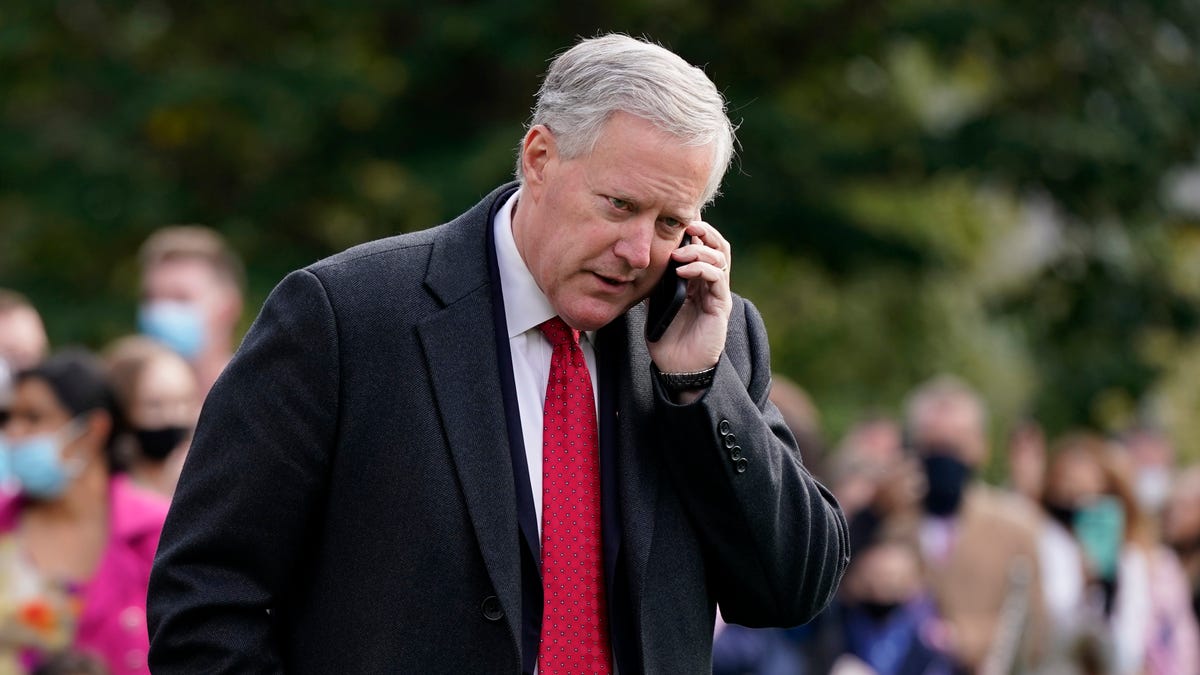 White House chief of staff Mark Meadows speaks on a phone on the South Lawn of the White House in Washington, on Oct. 30, 2020.