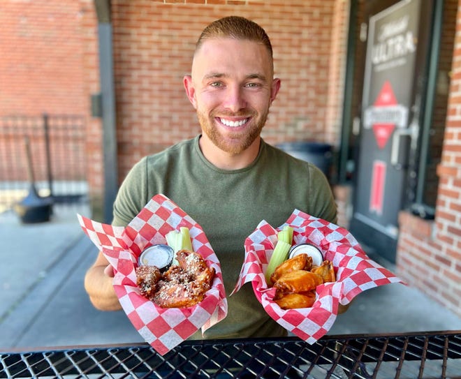 Austin Yochus gets ready to chow down on one of his favorite snacks at Pastimes Pub at Crosswoods, one of the more than 100 eateries on his spreadsheet of wing stops.