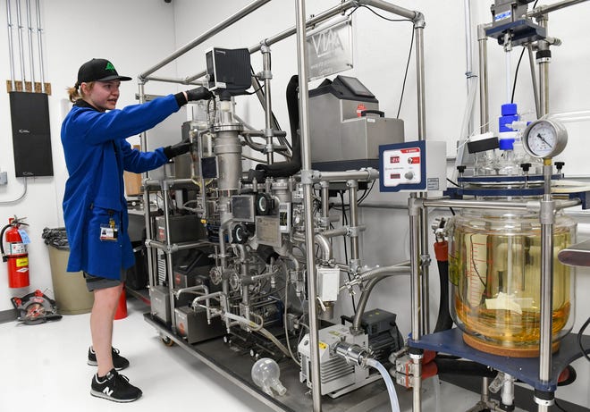 Brandon Trauger, extraction manager, checks on the VTA distillation plant in the chemical lab at Native Nations Cannabis on Monday, June 27, 2022, in Flandreau. The distiller extracts THC.