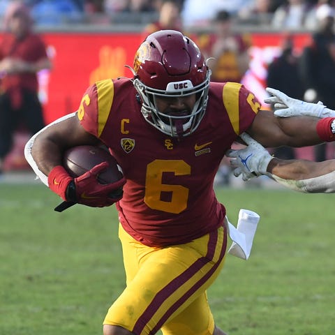 USC running back Vavae Malepeai runs the ball agai