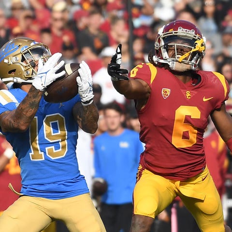 UCLA running back Kazmeir Allen (19) catches a tou