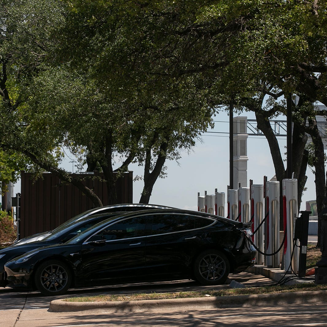Electric vehicles charge at the Tesla supercharger station off Middle Fiskville Road in North Austin on Friday, July 1, 2022. 