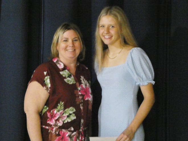 Pontiac Township High School hosted its annual Awards Night at the end of the school year. Among the awards presented to PTHS seniors was the MACC Scholarship that was presented by Jenny Larkin (left) to Brooke Fox and Ty Jensen (absent).