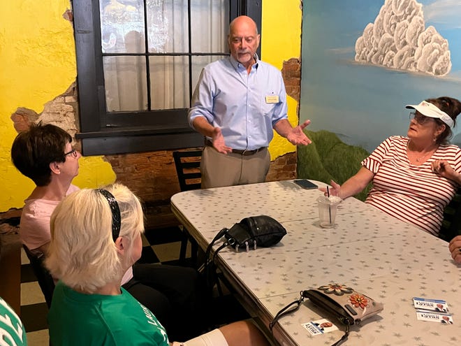 Lou Lyras, the Democratic candidate for Congress in the Sixth District, speakers to residents at the Daily Grind Cafe in New Philadelphia on Friday.