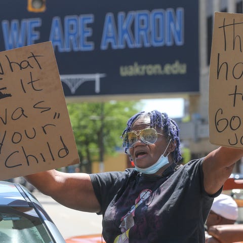 Gloria Beasley stands with protesters on South Hig