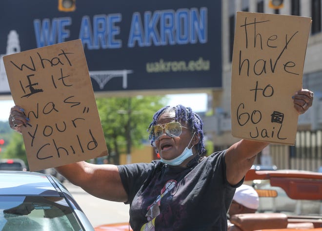Gloria Beasley stands with protesters on South High Street in front of the Stubbs Justice Center on Saturday, July 2, 2022 in Akron, Ohio, calling for justice for Jayland Walker after he was shot dead by Akron Police in Monday.