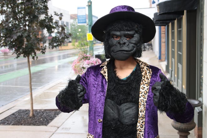 David Garcia poses in the gorilla costume he wore Friday, July 1, 2022, at First Fridays in Adrian.