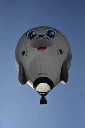 Pat Rolfe's Cynthia Seal balloon takes flight at Fort Custer Recreational Area in Augusta Saturday, July 2, 2022. The balloon is named after the late Cindy Rolfe.