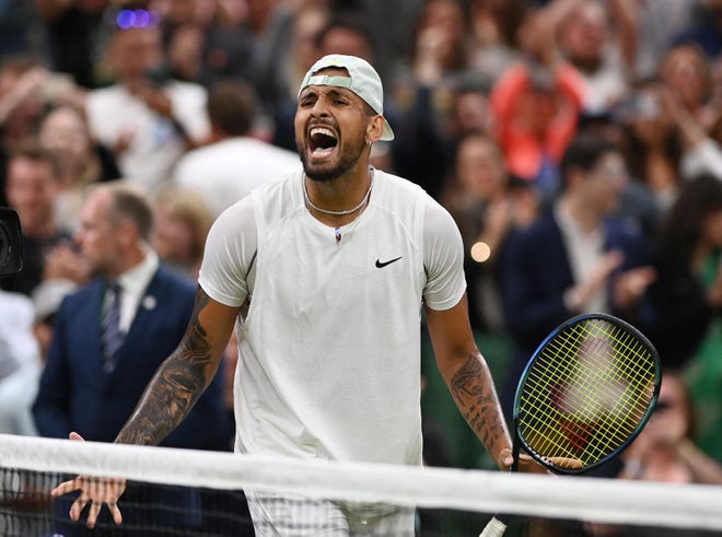 Nick Kyrgios celebrates after beating Stefanos Tsitsipas in the third round of Wimbledon.