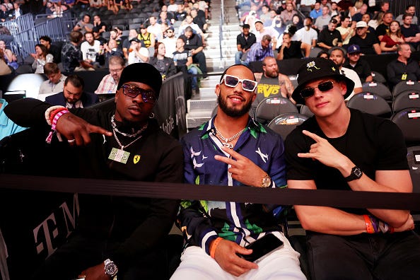 (Left to right) Chidobe Awuzie, Jessie Bates III and Joe Burrow traveled to Las Vegas, Nevada to attend UFC 276 at T-Mobile Arena in July 2022. Awuzie shared a shopping story from the trip in a recent interview.