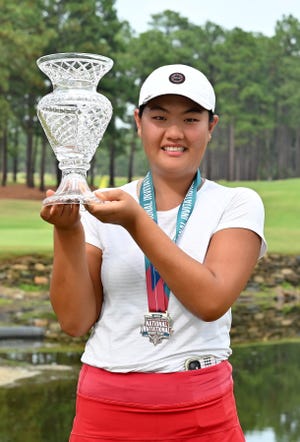 Jennifer Seo of Arizona celebrates with the trophy after winning the PGA National High School Girls Invitational at Pinehurst Resort on June 29, 2022 in Pinehurst, North Carolina.