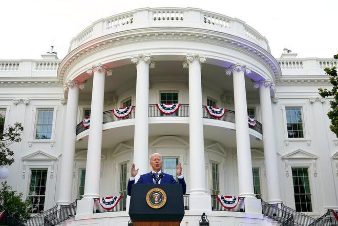 FILE - President Joe Biden speaks during an Independence Day celebration on the South Lawn of the White House, July 4, 2021, in Washington. Last Fourth of July, Biden gathered hundreds of people outside the White House for an event that would have been unthinkable for many Americans the previous year. With the coronavirus in retreat, they ate hamburgers and watched fireworks over the National Mall. (AP Photo/Patrick Semansky, File)