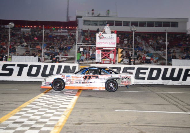 Casey Fleegle takes the checkered flag in the Ron's Collision Center Street Stocks feature, Sunday, at Jennerstown Speedway.