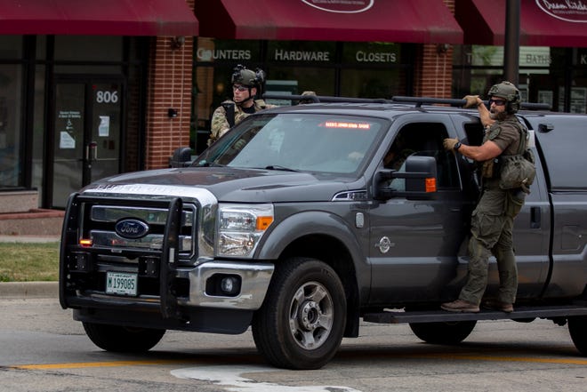 First responders work the scene of a shooting at a Fourth of July parade in Highland Park, Ill.