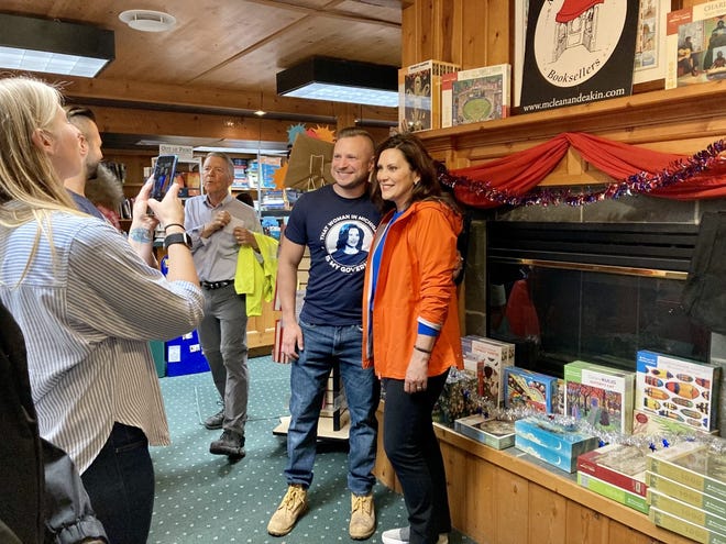 Governor Gretchen Whitmer poses for photos with members of the community while visiting McLean and Eakin Booksellers in Petoskey.