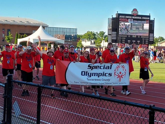 The Rockets carry their banner In the parade of Athletes as part of the Opening Ceremonies.