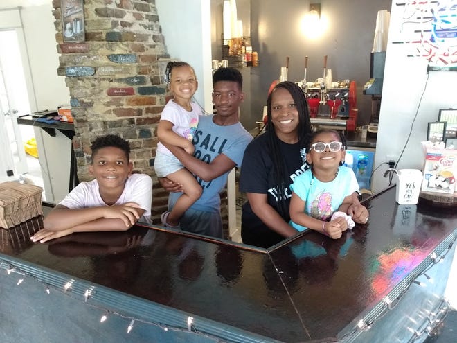 Business is a family affair at Fondren’s newest coffee shop, Deja Brew Bistro on Mitchell Avenue. Pictured is owner Cynthia Pickens with her grandchildren, from left, Carter, Harlem, Kaden and Brooklyn.