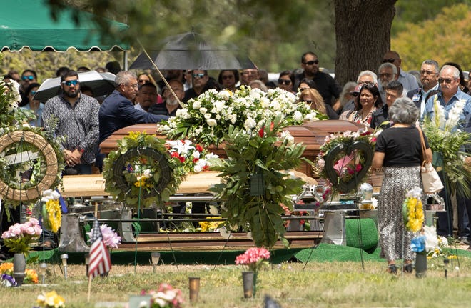 Mourners pay their respects at the funeral for Irma and Jose Garcia at Hillcrest Memorial Cemetery in Uvalde on Wednesday June 1, 2022. Irma was a teacher at Robb Elementary School and was killed when a shooter entered the school, killing 19 students and 2 adults. Jose Garcia died of a heart attack in the days following the shooting.
