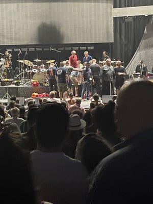Medical personnel attend to guitarist Carlos Santana after he collapsed on stage at the Pine Knob Music Theater, July 5, 2022.