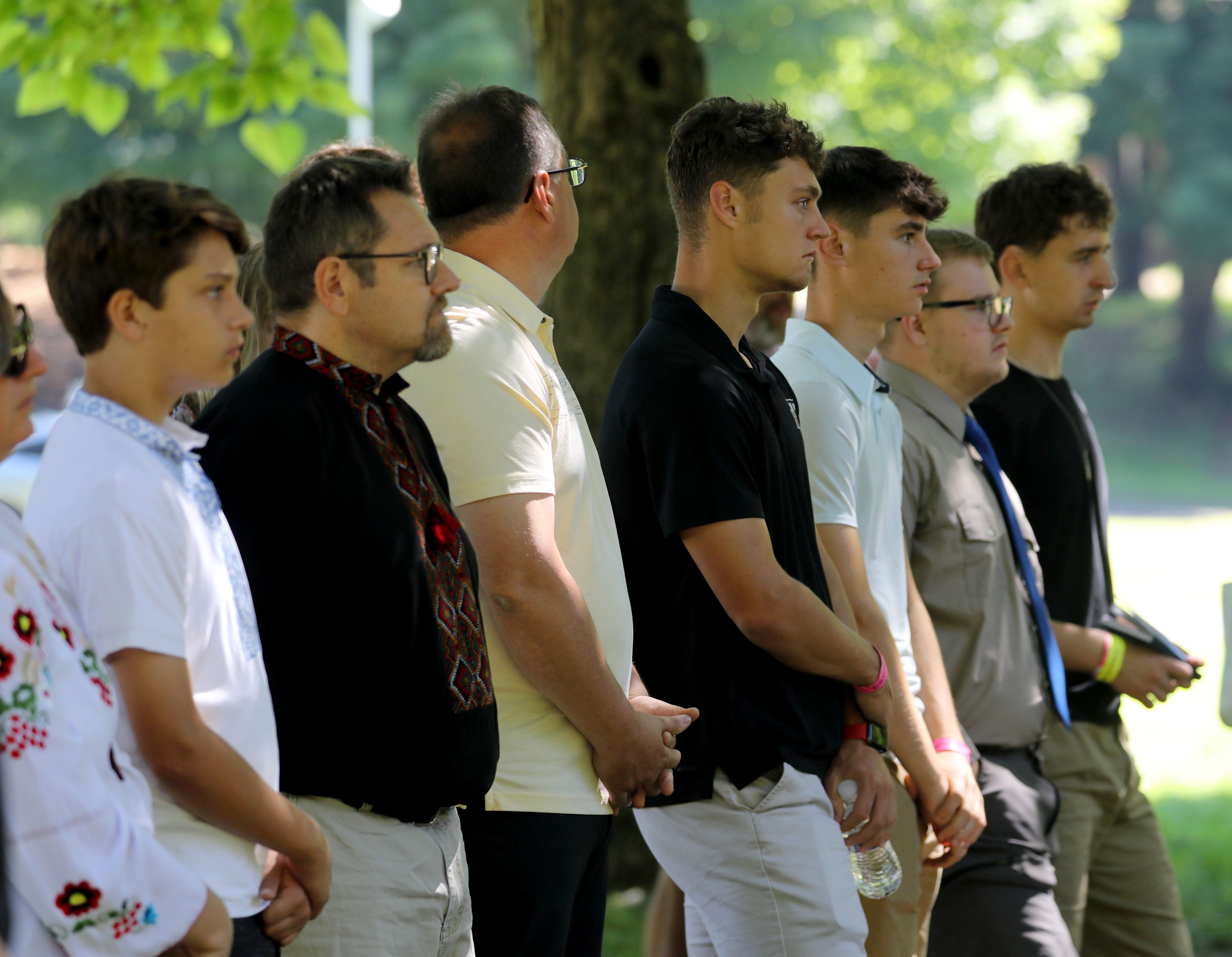 Men attend an outdoor mass in the Ukrainian Greek Catholic Church tradition at the Ukrainian American Youth Association's resort center in Ellenville, New York, on July 3, 2022.