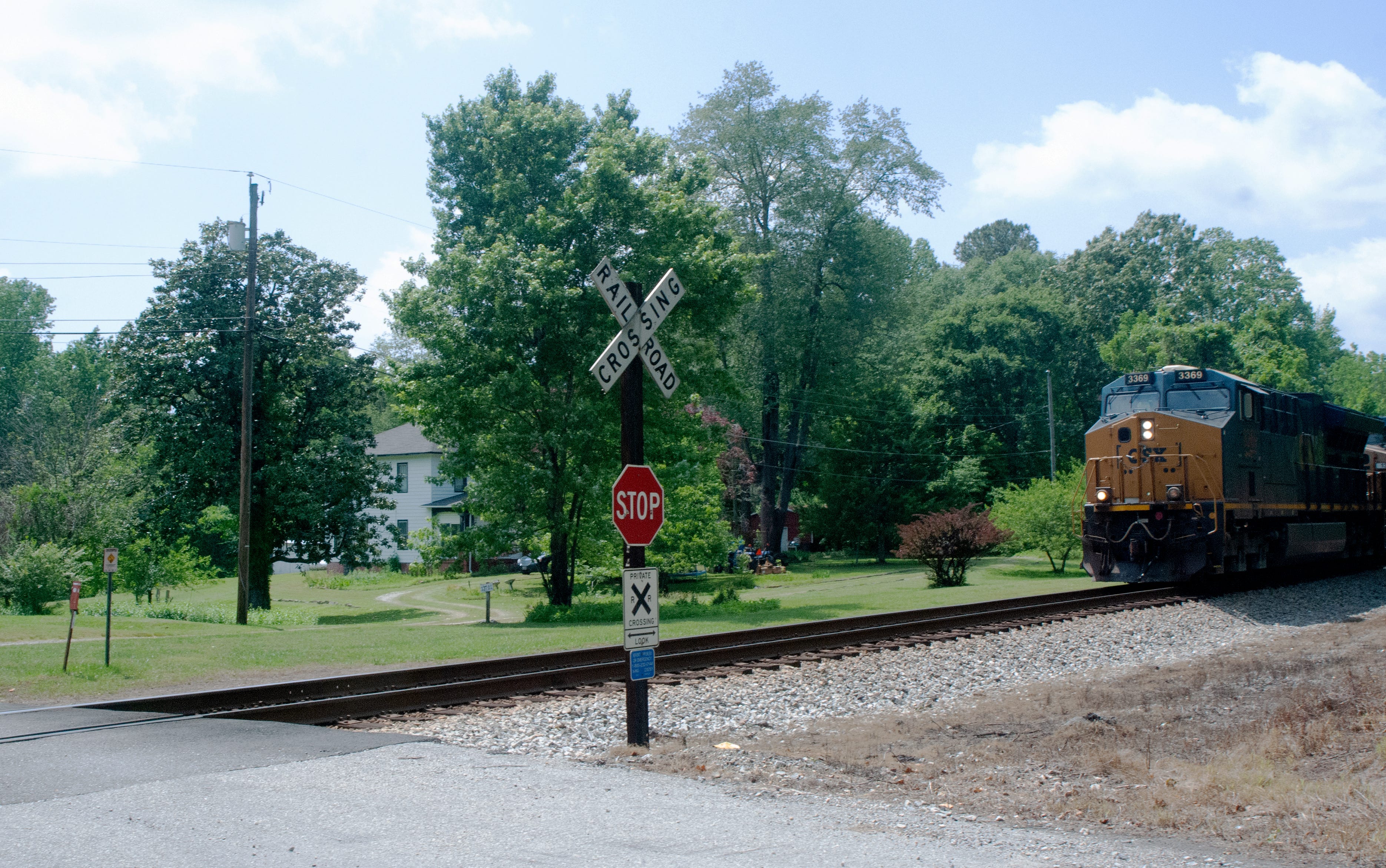 A CSX train passes a private crossing in Lanexa, Virginia.