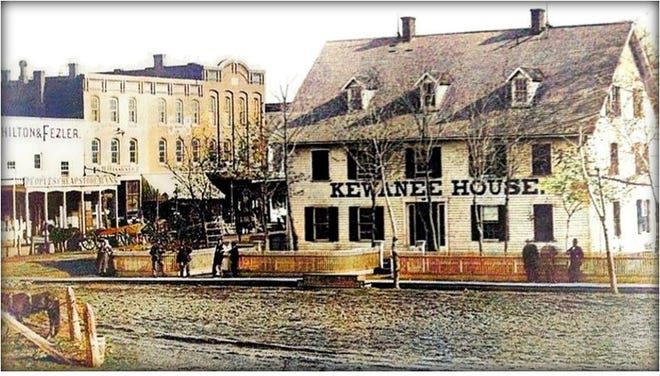 Kewanee House, with eastside Tremont Street businesses in the background. In the foreground, lower left, is the base of the "Liberty Pole." This photo was taken from the railroad freight house, circa 1870.