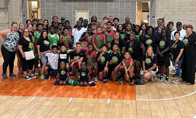 Parents, players and family members of Phenom Nation take a group picture at the U.S. Amateur Boys Basketball National Championships. The Phenom 2027 and 2028 teams won the national championship in their respective divisions.