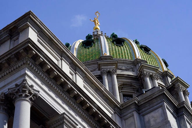 FILE - Pennsylvania Capitol in Harrisburg, Pa., on April 4, 2022. Most Pennsylvania lawmakers were absent from the state Capitol on Tuesday, July 5, 2022, five days into the new budget year without a state government spending agreement in place. (AP Photo/Matt Rourke, File)