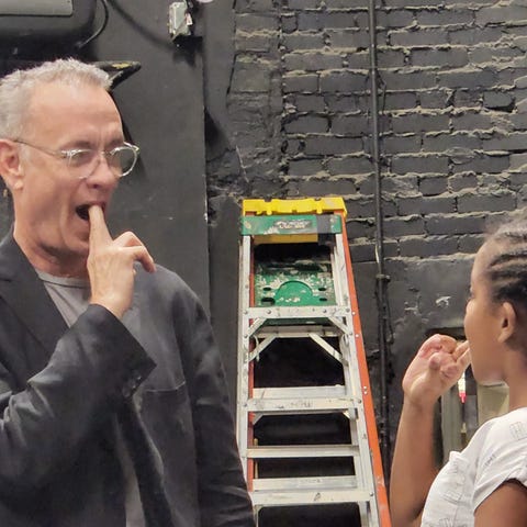 Tom Hanks coaches actor Leyu Girma during rehears