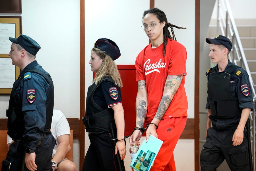 WNBA star and two-time Olympic gold medalist Brittney Griner is escorted to a courtroom outside Moscow on July 7, 2022.