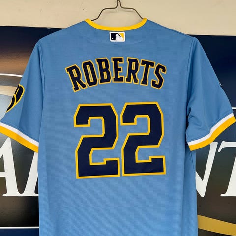 A City Connect jersey hangs in the Brewers dugout,