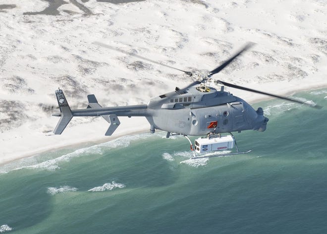 An MQ-8C Fire Scout, a U.S. Navy Unmanned Aerial System, demonstrates a new mine countermeasure prototype technology in May at Eglin AFB. The demonstration proved a capability that could allow the warfighter to rapidly detect and respond to threats.