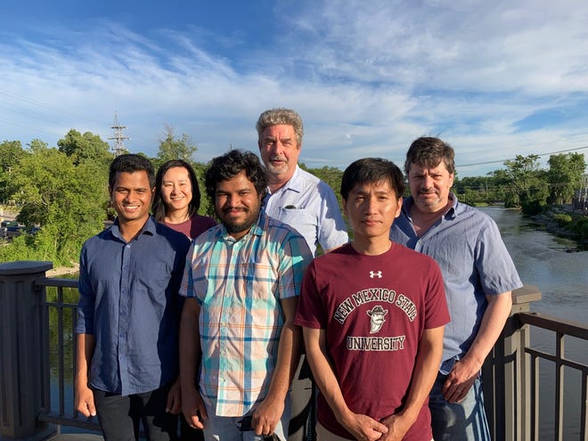 From Left: Graduate research assistant Harsha Arachchige, Lu Ren, post-doctoral researcher and graduate researcher Dinupa Nawarathne are with Physics Professor Stephen Pate, post-doctoral researcher Abinash Pun and Physics Professor Vassili Papavassiliou. The group is continuing particle physics research on MicroBooNE and SpinQuest projects thanks to a three-year, $1.26 million Department of Energy grant renewal.