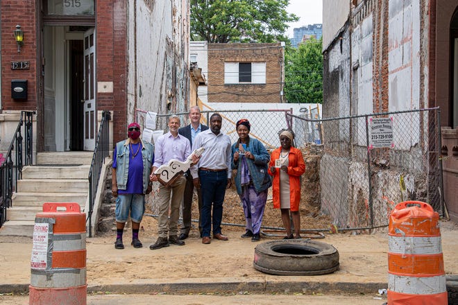 From left are resident James Morton; Richard Gliniak, a Democratic committee person; Paul Steinke of the Preservation Alliance; Councilmember Kenyatta Johnson; resident Linda Evans, and resident Samara Johnson, in front of a demolished property on the 1500 block of Christian Street in Philadelphia in May 2021. A new designation of the Christian Street/Black Doctors Row Historic District will halt demolitions in the area. (Jose F. Moreno/The Philadelphia Inquirer/TNS) From left are resident James Morton; Richard Gliniak, a Democratic committee person; Paul Steinke of the Preservation Alliance; Councilmember Kenyatta Johnson; resident Linda Evans, and resident Samara Johnson, in front of a demolished property on the 1500 block of Christian Street in Philadelphia in May 2021. A new designation of the Christian Street/Black Doctors Row Historic District will halt demolitions in the area. (Jose F. Moreno/The Philadelphia Inquirer/TNS)