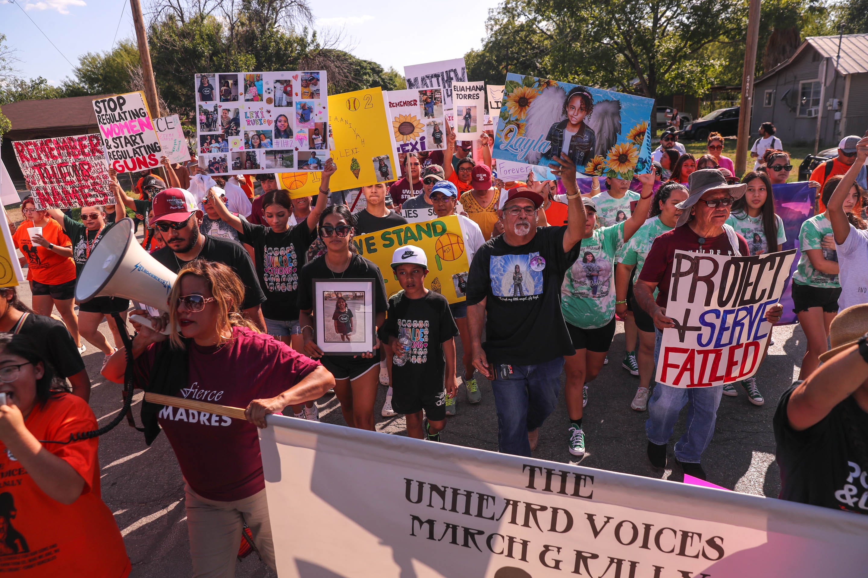 Hundreds of people march through Uvalde on July 10 to call for transparency in the investigation of law enforcement's response to the Robb Elementary School shooting and to call for gun reform.