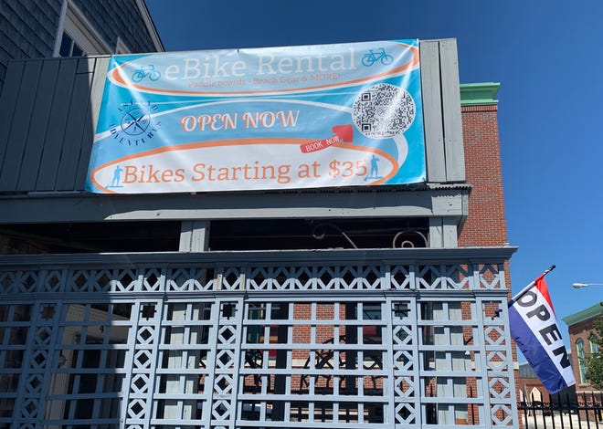 An advertising sign hangs on Island Adventures at 4 Spring Wharf in Newport.