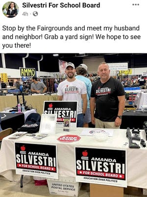 A screenshot of a now-deleted post to school board candidate Amanda Silvestri's campaign Facebook page shows her husband and neighbor passing out campaign literature at the Florida Gun and Knife Show held in West Palm Beach on July 9 and July 10, 2022. Silvestri said her neighbor was hosting a booth and asked her last minute if she wanted to bring her campaign materials to the show. PHOTO PROVIDED TO THE PALM BEACH POST