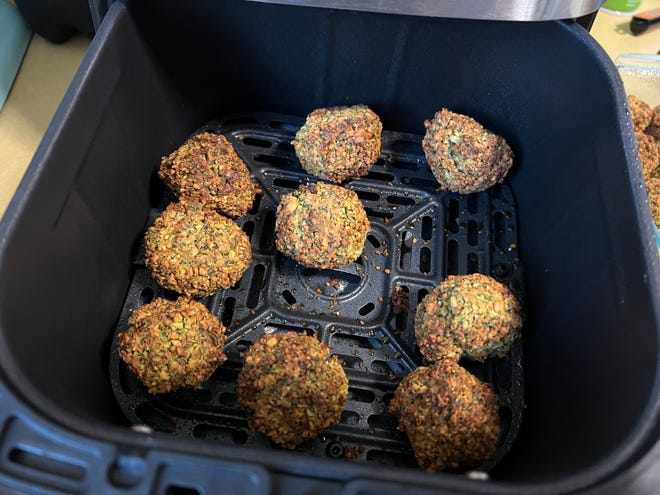 Cons of making falafel in the air fryer: it takes longer and the size of the batch depends on the size of the air fryer. Pros of using the air fryer: the clean up is so much quicker.