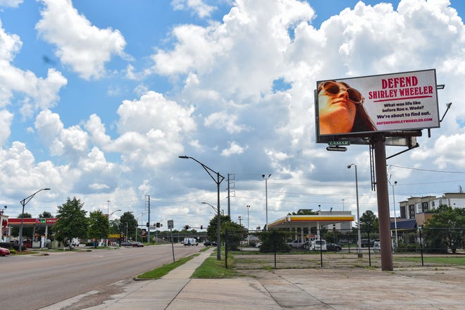 A billboard advertising an upcoming season of Slate's podcast "Slow Burn," which focuses on the history of Roe v. Wade, is seen in Jackson, Miss., on Friday, July 8, 2022. The billboard is one of several that have been placed in cities with decreasing abortion access.